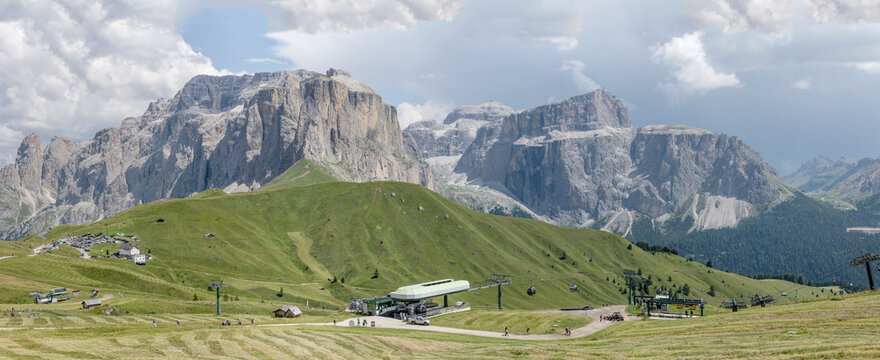Pradel cable car and Sella pass alpine shelter from Col Rodella, Italy