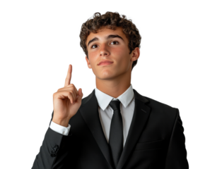 Young man in a black suit gestures confidently while pointing upwards in a neutral setting