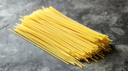 Fresh pasta strands delicately arranged on a gray stone surface, with wide open copy space for food-related announcements, perfect for restaurant promotions or culinary publications. -