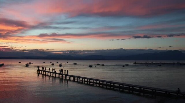Panoramic lakeview at sunset from lakeside walkway at Pacengo, Lazise, Lake Garda, Italy