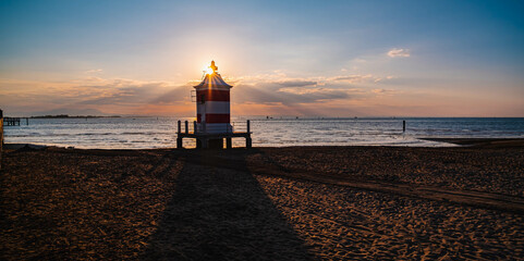 lighthouse at sunrise in italy