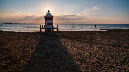 lighthouse at sunrise in italy