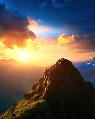 Naklejka premium Majestic Mountain Peak at Sunset with Dramatic Sky