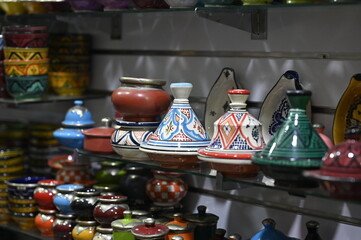 Traditional Moroccan Tagine Pot : A beautifully handcrafted Moroccan tagine pot, made from natural clay and painted with traditional Berber designs.