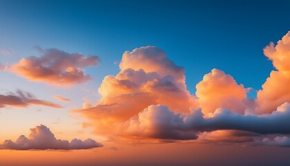 Obraz premium beautiful orange clouds in the blue sunset sky