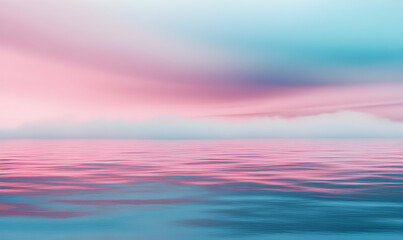 Obraz premium A soft and dreamy pink and blue sky reflected in the calm ocean water, creating a serene and tranquil scene.