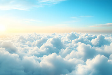 A panoramic view of fluffy white clouds with a bright blue sky and golden sunlight above.