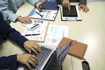 Group of business people discussing work and agreeing to work together. Business people discussing projects in office using laptops. Business people shaking hands in conference room. Video.