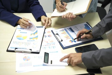 Group of business people discussing work and agreeing to work together. Business people discussing projects in office using laptops. Business people shaking hands in conference room. Video.