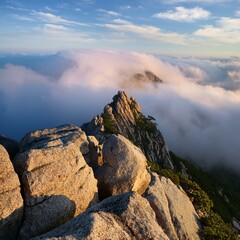 Obraz premium rocks on the top of mountain with clouds in the background