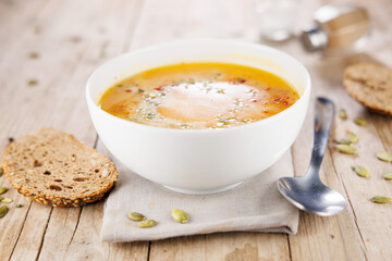Soup bowl, spoon and bread
