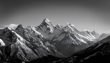 black and white image of snow capped mountains