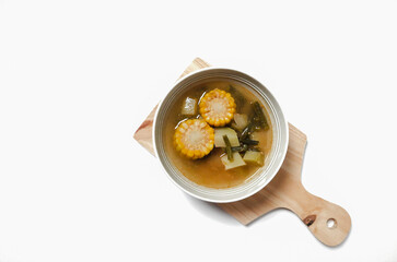 Sayur asam or sayur asem is popular soup in Indonesia. Served in a bowl on isolated white background