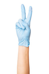 Hand in medical gloves showing the number two or making a peace sign on an empty background. Counting, positive gestures, healthcare communication.