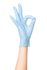 Hand in medical gloves making an OK sign on an empty background. Approval, positive feedback,...