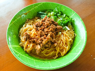 Delicious Chicken Noodles Served with Fresh Green Onions and Vegetables