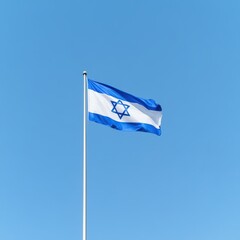 Israeli flag waving against blue sky