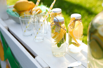 Lemonade stand with refreshing drink in park