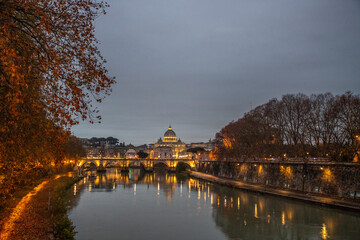 View over the Tiber River in a historic city. The old well-known bridge Ponte Sant'Angelo, in the...
