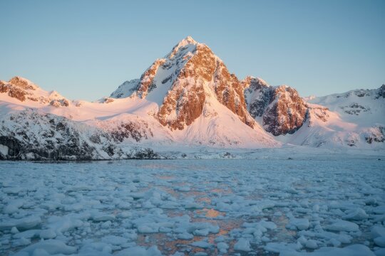 Mount Vinson At Golden Hour With Icy Terrain And Golden Sky Gradation