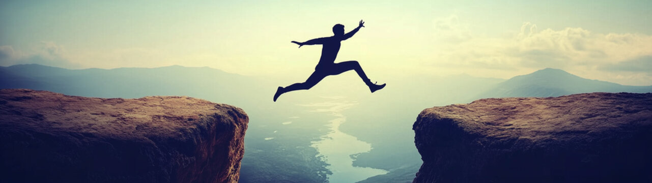 Silhouette man jumping over cliffs for I can do it, good mindset, freedom, good mindset, photo, poster, conceptual art, success, goals 