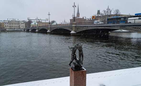 Stockholm, Sweden - February 23, 2023: Statue with at the background the Vasabron bridge in Stockholm, Sweden