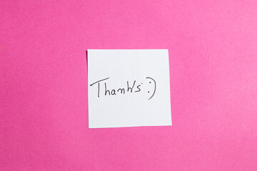 A white piece of paper with the word 