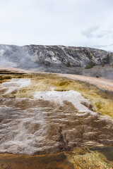 Scenic View of Geothermal Terraces in Yellowstone National Park, Wyoming on a Cloudy Day