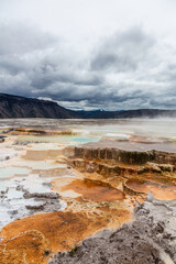 Scenic View of Mammoth Hot Springs in Yellowstone National Park, Wyoming on a Cloudy Day