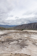 Scenic View of Yellowstone National Park in Wyoming, USA Featuring Rocky Terrain and Expansive Sky