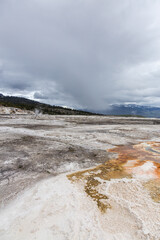 Breathtaking View of Volcanic Landscape in Yellowstone National Park, Wyoming, USA on a Cloudy Day with Expansive Sky