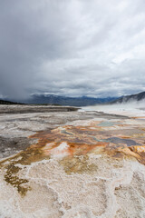 Breathtaking Landscape of Yellowstone National Park Geothermal Area Under Dramatic Cloudy Skies