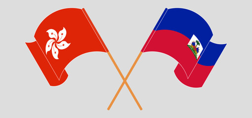 Crossed and waving flags of Hong Kong and Republic of Haiti. Vector illustration