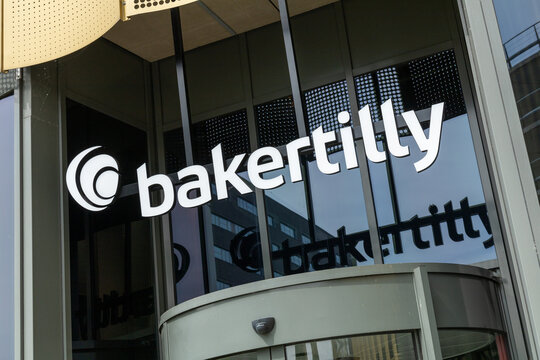 Baker Tilly logo sign above the entrance of the Bakertilly office. Utrecht, the Netherlands. 20 May 2023. B