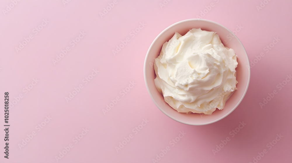 Poster 1. a top-down view of a bowl of creamy sour cream placed on a soft pastel background, creating a cle