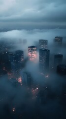Obraz premium Aerial view of modern cityscape shrouded in fog with skyscrapers illuminated by warm lights