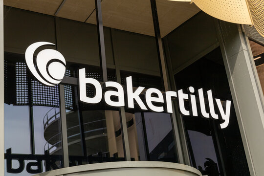 Baker Tilly logo sign above the entrance of the Bakertilly office. Utrecht, the Netherlands. 20 May 2023. B