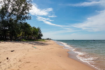 Pristine sand beach of luxury resort on Phu Quoc island, Vietnam, South East Asia. Relaxing getaway tropical island. Enjoyment of natural beauty in tranquil atmosphere. Jungle along scenic coastline