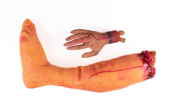 halloween severed toy leg isolated on white background