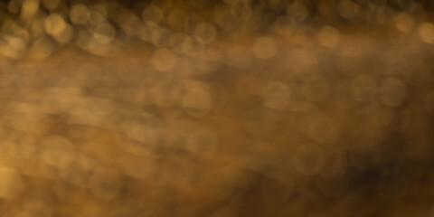 Blurred golden surface. Artistic background with space for text
