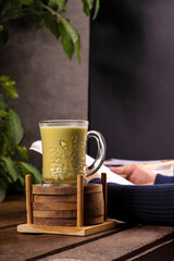 a glass of hot matcha