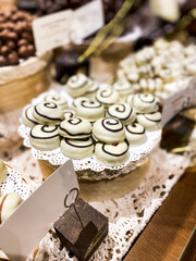 Shelves with candies and chocolates in a craft sweet shop. Sweets and chocolate concept