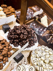 Shelves with candies and chocolates in a craft sweet shop. Sweets and chocolate concept