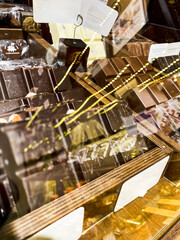 Shelves with candies and chocolates in a craft sweet shop. Sweets and chocolate concept