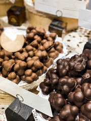 Shelves with candies and chocolates in a craft sweet shop. Sweets and chocolate concept