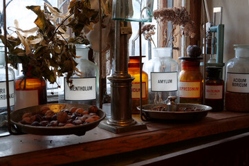 Old bottles with medications and chemicals substances in an old pharmacy