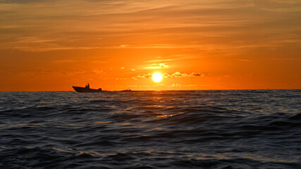 Sunrise over the water surface of the Atlantic Ocean