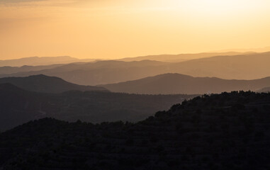 Beautiful sunset in the mountains. Mountain layers. Orange sky. Near Stavrovouni Monastery in Cyprus