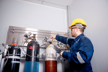 Engineers check the volume of gas tanks and check the pressure valves of each gas tank to check the...