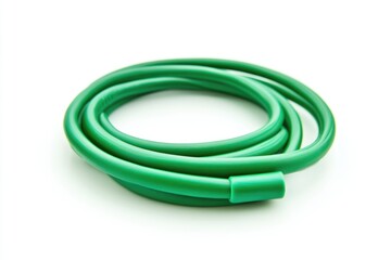 Fototapeta premium Close-up shot of a green hose lying on a white surface, great for backgrounds or textures